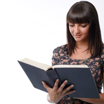 Portrait of a young woman reading the Bible