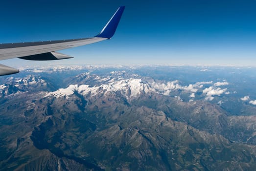 alps between switzerland and italy seen from the plane
