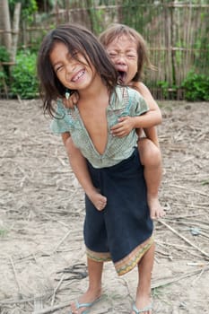 Children from Asia,especially in Laos,live with dirty clothes and no chance of education