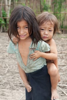 Children from Asia,especially in Laos,live with dirty clothes and no chance of education