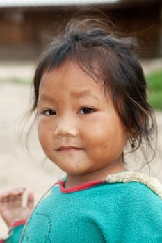 Portrait of asian girl,child with old clothes and dirty face