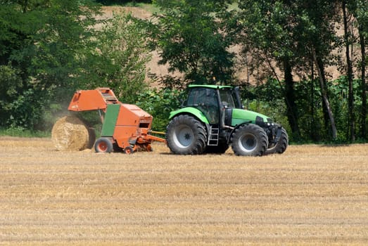 tractor with hay bales to catch the