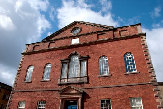 A Red Brick Chapel in Yorkshire under a blue sky