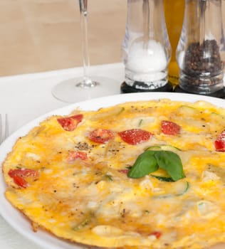 Egg Omelette With Tomatoes and Basil on the Table
