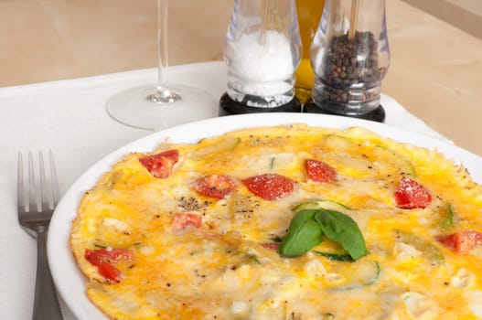 Egg Omelette With Tomatoes and Basil on the Table
