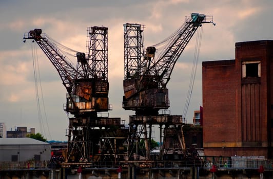 Two rusty cranes at Battersea power station, London, UK