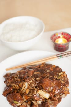 Kung Pao - chinese food with rice and chop sticks