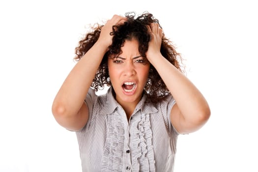 Frustrated angry formal corporate business woman with curly hairwith hands in hair and screaming yelling, isolated.