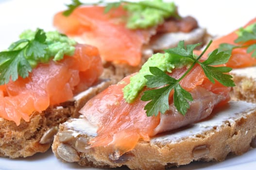 sandwich with smoked salmon isolated on white background
