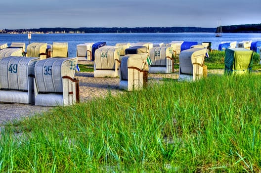 some hooded beachchairs at a beach near Kiel, Germany