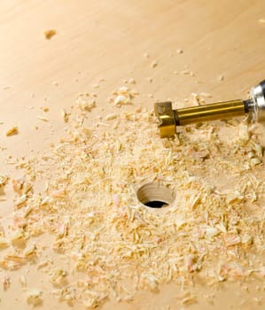 Making a hole in wood box with a bradall prior to screwing