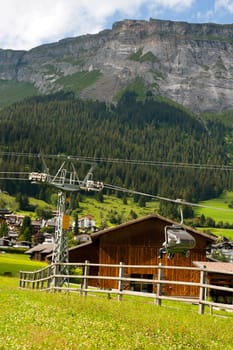 Chairlift in front of mountain panorama