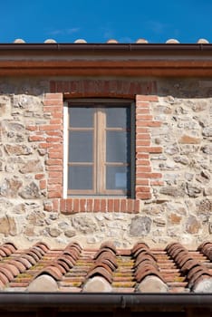stone and brick wall with window