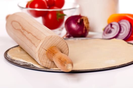 Roll out pizza dough