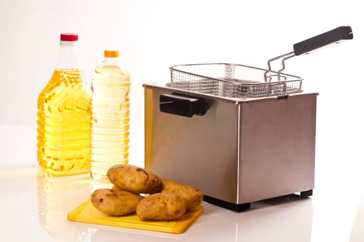 Stainless steel fryer on white background