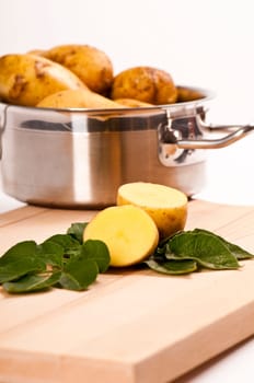 fresh potatoes in stainless steel saucepan