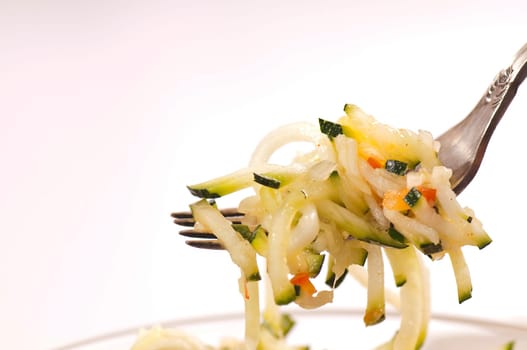 Zucchini salad in glass bowl