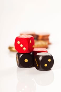 Dice with coins in the background