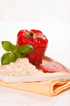 stuffed red peppers with rice and herbs served on plates