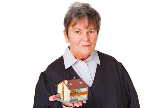 Female lawyer with model house isolated on white background