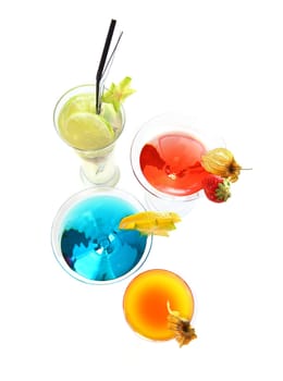 Different cocktails or longdrinks garnished with fruits