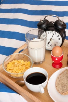 Breakfast in Bed - Bread, Coffee, Boiled Egg, Milk, Corn Flakes and Alarm Clock