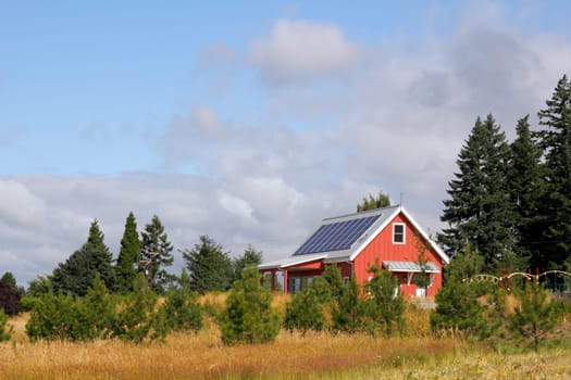 Solar panels on the roof of a public building in a park.