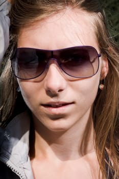 Pretty woman with sunglasses and long hair
