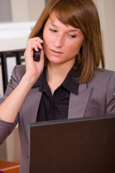 woman secretary on phone by office work