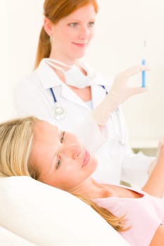 Female medical doctor apply injection woman patient