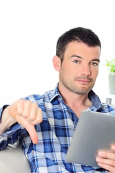 attractive relaxed and negative man is surfing on his