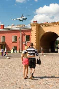 The young couple walks in the Peter and Paul Fortress in St.-Petersburg