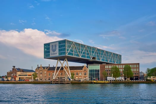 ROTTERDAM, NETHERLANDS - MAY 11, 2017: Unilever Bestfoods headquarters building De Brug (The Bridge) built over an existing historical factory from 1891 designed by architect Chris de Jonge