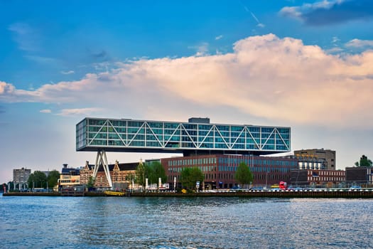 ROTTERDAM, NETHERLANDS - MAY 11, 2017: Unilever Bestfoods headquarters building De Brug (The Bridge) built over an existing historical factory from 1891 designed by architect Chris de Jonge