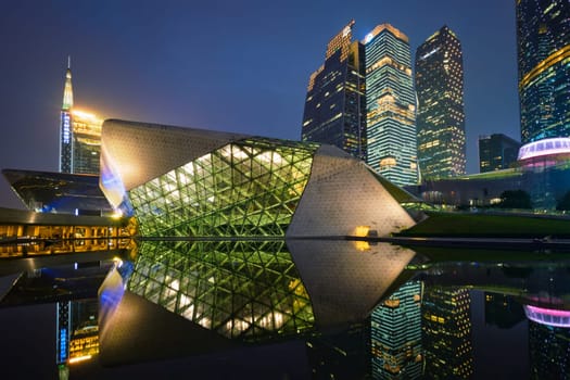 GUANGZHOU, CHINA - APRIL 27, 2018: Guangzhou Opera House designed by famous Iraqi architect architect Zaha Hadid illluminated at night