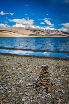 Stone cairn at Himalayan lake Tso Moriri, Korzok, Changthang area, Ladakh, Jammu and Kashmir, India