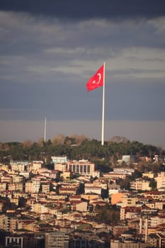 Cityscape of istanbul with turkish flag . High quality photo