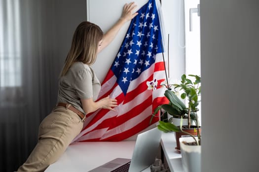 woman with laptop and usa flag. Foreign languages learning, educational online course. High quality photo