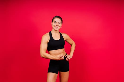 Young woman athletic female MMA fighter is training. Concept of sport, action, healthy lifestyle.