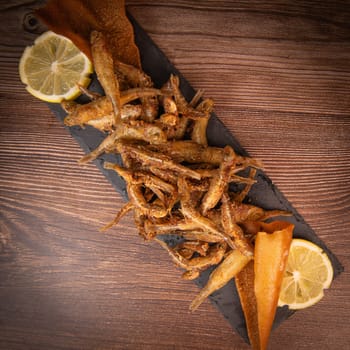 DEEP FRIED SEEFOOD, RECIPE FOR FISH, Smelt AND FRIED PITA, LEMON. High quality photo