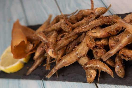 DEEP FRIED SEEFOOD, RECIPE FOR FISH, Smelt AND FRIED PITA, LEMON. High quality photo