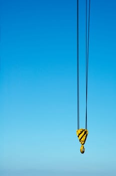 hook from crane against blue sky