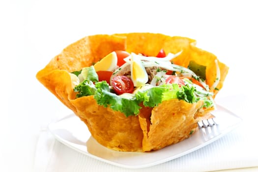 Big gourmet salad with mixed vegetable and tuna - served in tortilla bowl