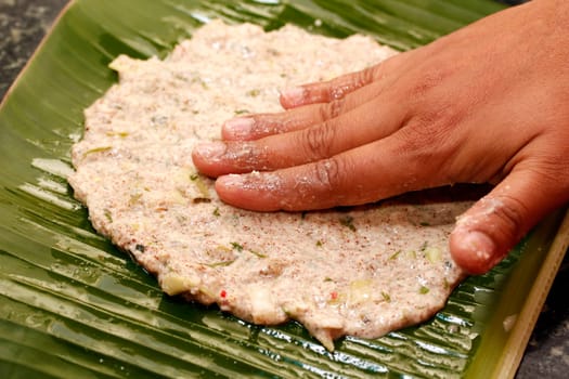 Making process of indian bread on a plantain leaf