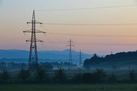 rural landscape with high voltage electricity power line.