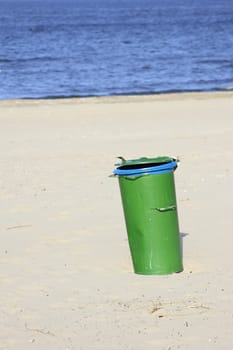 green garbage can on the beach of the island of Usedom,Mecklenburg-Western Pomerania,Germany