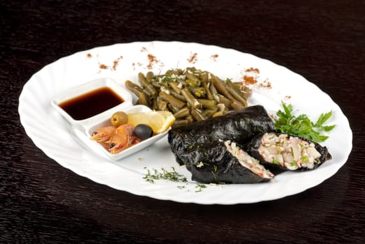 souffle of fillet of pikeperch, shrimps, crab meat, coconut and leek wrapped at nori garnished by string beans