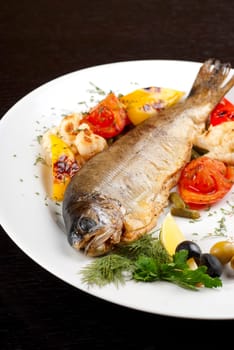 trout fish baked with pepper, string beans, tomato and cauliflower