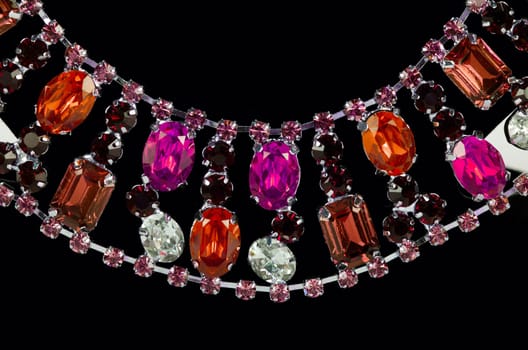 pendant closeup with big gem at black background