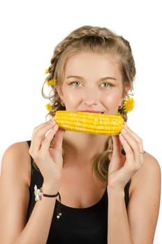 Close-up portrait of young beauty woman eating corn-cob on a white